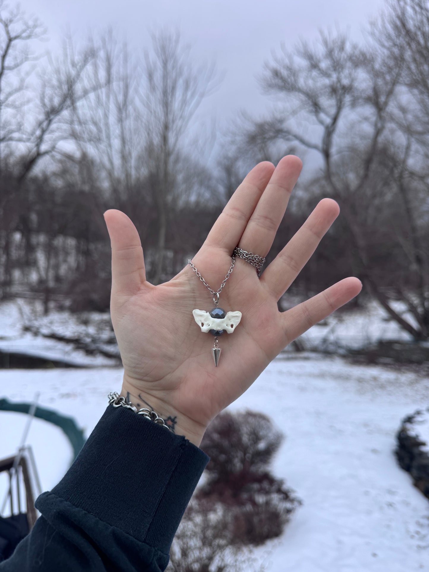 Silver Mink Atlas Vertebrae Necklace